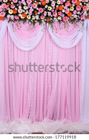 wedding scene, beautiful background made from fabric and flowers decoration in wedding ceremony