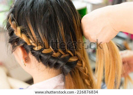 long braid creative brown hair style in salon beauty