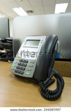 black telephone on table work of office