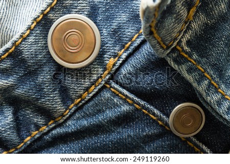 metal botton on fashion blue jeans