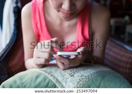 women lifestyle used a mobile phone in cafe coffee shop with texting message on app smartphone playing social network