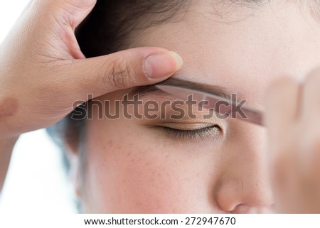 makeup artist used eyebrow scissors makeup a pretty woman face