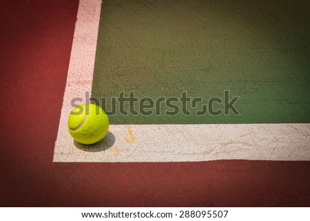 tennis ball on green court, sport background, image used vintage filter