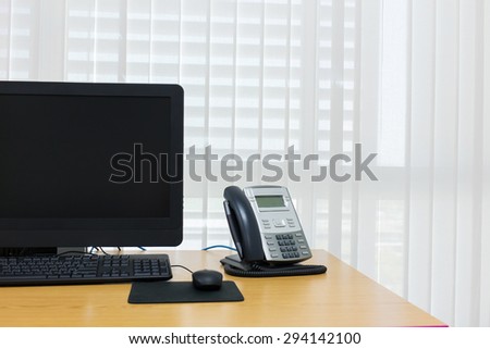 telephone and computer on table work of room service office