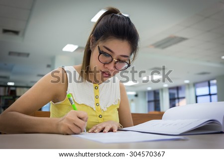 study education, woman writing on a paper, working women