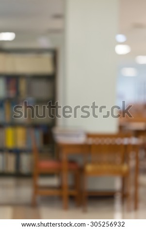 bookshelf and table desk in library, education abstract blur de-focused background