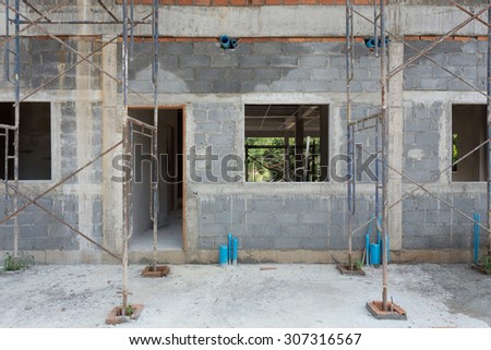 building residential construction house with scaffold steel for construction worker, wall made from brick