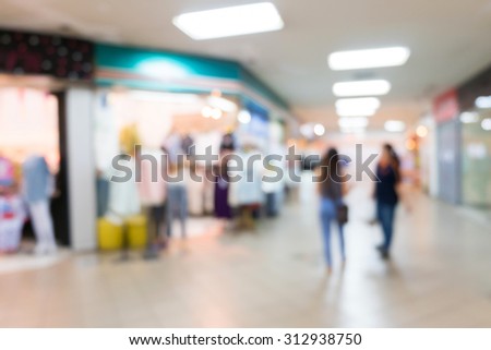 blur background, department store with storefronts fashion clothes