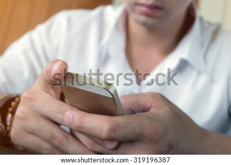 businessman using a mobile phone with texting message on app smartphone, playing internet on mobile