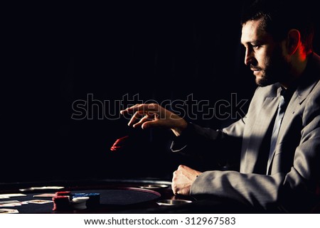 Concept: A high stakes poker player is frustrated and emotional over losing and finding it hard to contain his emotions. Cinematic portrait.