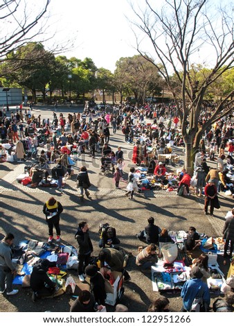 HARAJUKU,TOKYO - DECEMBER 16: Shoppers come to flea market at Yoyogi Park in Harajuku on december 16,2012. It is the monthly flea market in the city of fashion Harajuku.