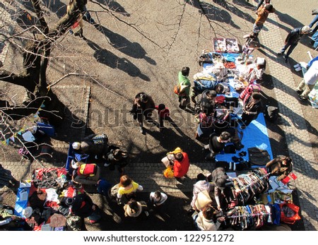 HARAJUKU,TOKYO - DECEMBER 16: Shoppers come to flea market at Yoyogi Park in Harajuku on december 16,2012. It is the monthly flea market in the city of fashion Harajuku.