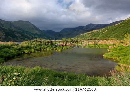The lake in mountains of the central Kamchatka in Russia in the summer