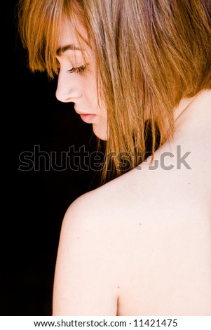 Nude shoulder in woman portrait.