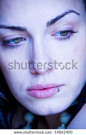 Young woman close portrait with impressive eyes.