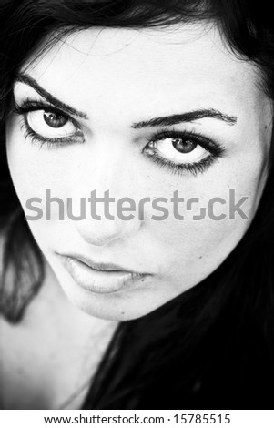 Young staring woman in contrasted black and white.
