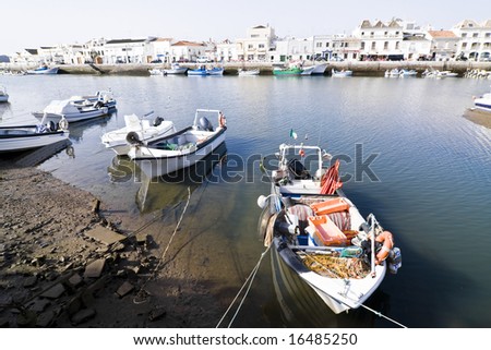 Small boats tied on Tavira sea channel