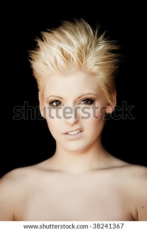 Young beautiful woman with digusting expression isolated on black