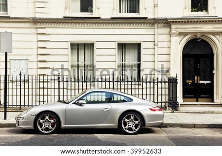 Luxury sport car in front of a house facade