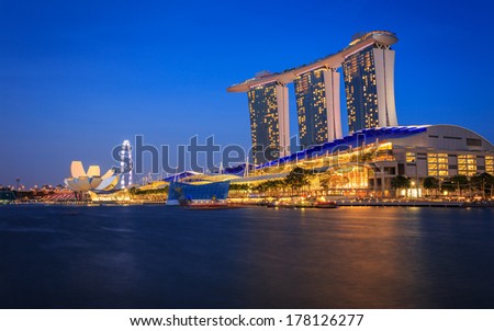 SINGAPORE - FEBRUARY 22: Dusk skyline of Marina Bay Sands, an integrated resort fronting Marina Bay, February 22, 2014 in Singapore. The wold\'s most expensive standalone casino property.