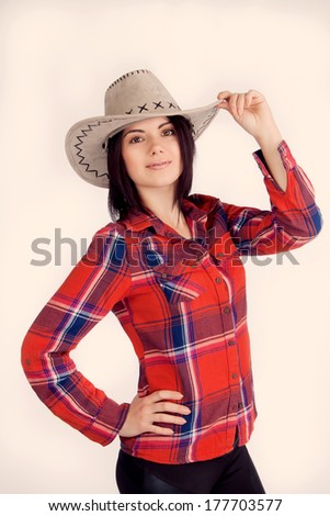 Girl cowboy hat and plaid shirt, cute smiling (retro)