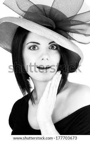 black and white portrait of a girl in a hat with an open mouth