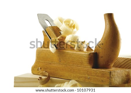 Wooden plane, boards and a shaving on a white background. Isolated object.