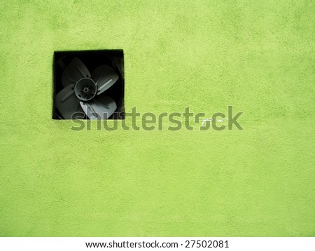 exhaust fan on green wall