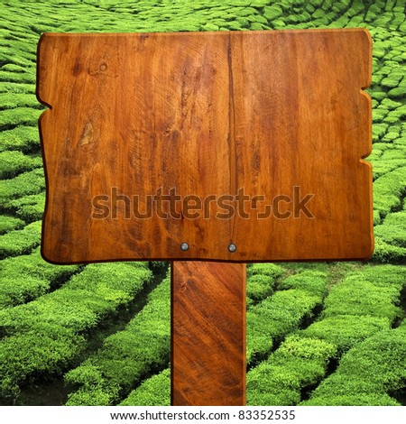 wood sign with hill background