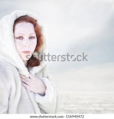 Woman in a warm white coat. Cold winter.
