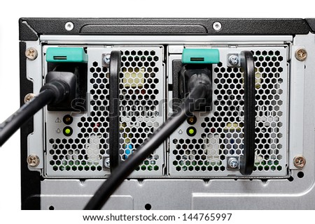 Double computer power supply in the server machine isolated on white