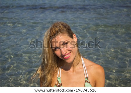 Happy woman enjoying sea water, face closeup