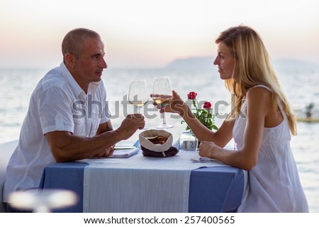 Couple dining in sea restaurant