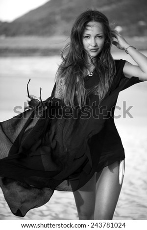 Fashion vogue woman portrait on beach black and white