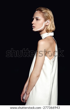 Blonde fashion woman in white coat minimal face art. White painted line.