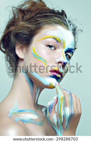 Color face art . Beauty portrait fashion model woman. Creative hair style and make-up