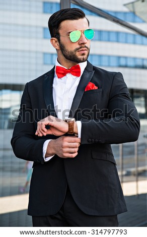 fashion man in sunglasses in urban setting