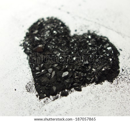 Shimmering heart made from graphite dust from perspective