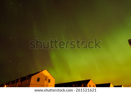 Aurora borealis. Northern Lights over the farmhouses in Northern Europe. 2015, March 17-18