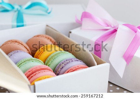 Set of various pastel colored macaroon and gift boxes with ribbon and bow