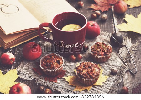 Homemade apple muffins and cup of tea for cozy autumn breakfast