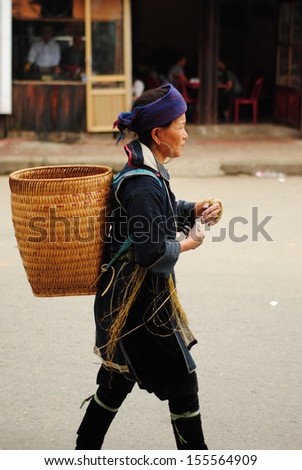 LAOCAI, VIETNAM, SEPTEMBER 2: Unidentified ethnic minority woman in a traditional market on September 2, 2010 in Laocai, Vietnam. There are many ethnic minority groups in Laocai