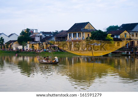HOIAN, VIETNAM, JANUARY 21: People on boat to visit Hoian ancient town on January 21, 2013 in Hoian, Vietnam. Hoian is recognized as a World Heritage Site by UNESCO.