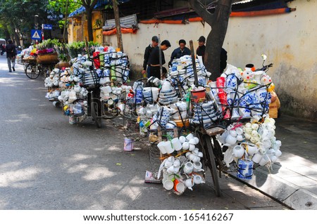 HANOI, VIETNAM, NOVEMBER 28: Bicycles with full of ceramic product of street vendors on November 28, 2013 in Hanoi, Vietnam. There are many street vendor with bicycle in Hanoi, Vietnam