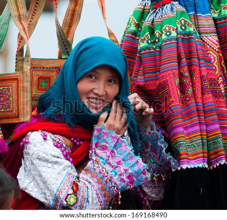 LAOCAI, VIETNAM, DECEMBER 28: H\'mong ethnic minority woman in Cancau traditional market on December 28, 2013 in Laocai, Vietnam. H\'mong is the 8th largest ethnic group in Vietnam.