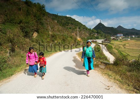 HAGIANG, VIETNAM, JUNE 15: Unidentified H\'mong ethnic minority people on the way to market on October 26, 2014 in Hagiang, Vietnam. Ha Giang stone highland has Dong Van Karst Plateau Global Geopark.