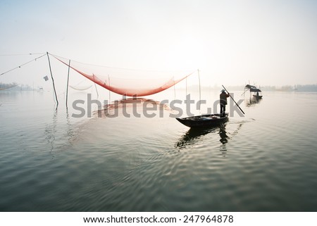 HOIAN, VIETNAM - JANUARY 23 : An unidentified fisherman worked in fishing village of Cua Dai, Hoi An, Vietnam on January 23, 2015. Hoian is recognized as a World Heritage Site by UNESCO.