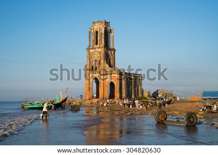 NAM DINH, VIETNAM - AUG 8, 2015: The fallen church (nha tho do) in sunrise in Hai Ly, Nam Dinh. The fallen church is the famous travel place in Nam Dinh.