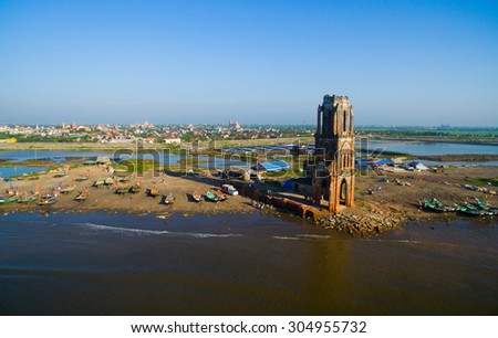 NAM DINH, VIETNAM - AUG 8, 2015: The fallen church (nha tho do) in sunrise in Hai Ly from highview, Nam Dinh. The fallen church is the famous travel place in Nam Dinh.