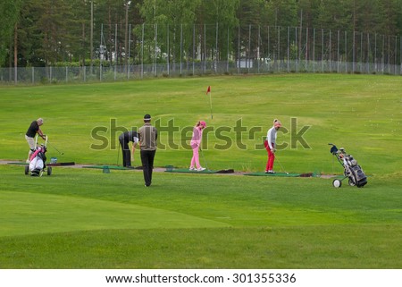 VIERUMAKI, FINLAND, June 23: Golf players to train under the guidance of a coach in a sports center, golf course - Vierumaki, one of the most favorite places in Finland, recreation, 23 June 2015.